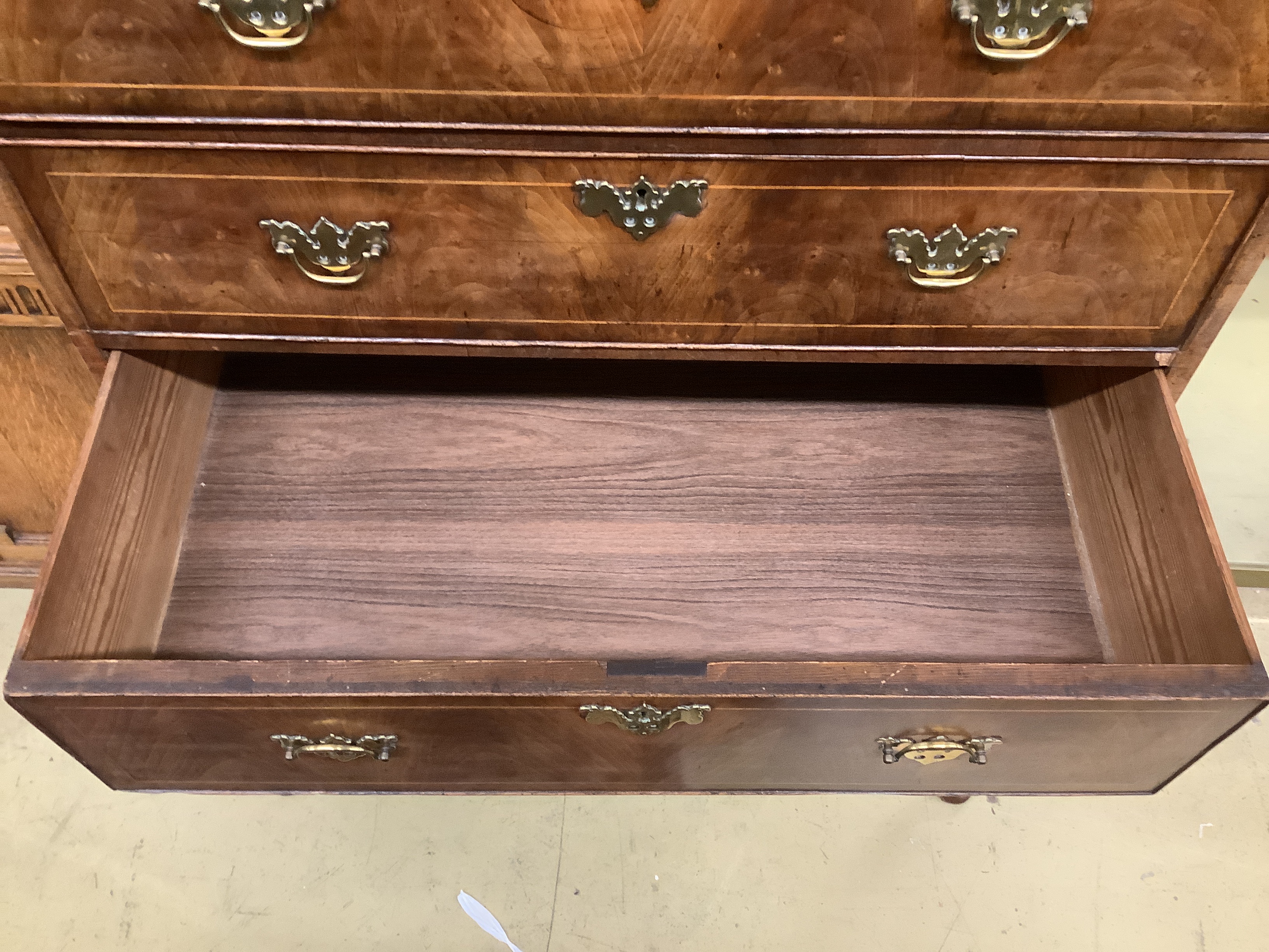 An 18th century walnut chest on stand, width 97cm, depth 56cm, height 146cm